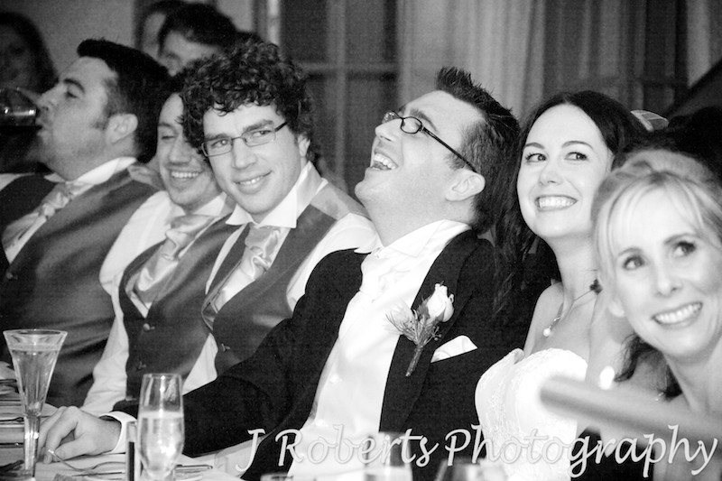Groom laughing at speeches - wedding photography sydney